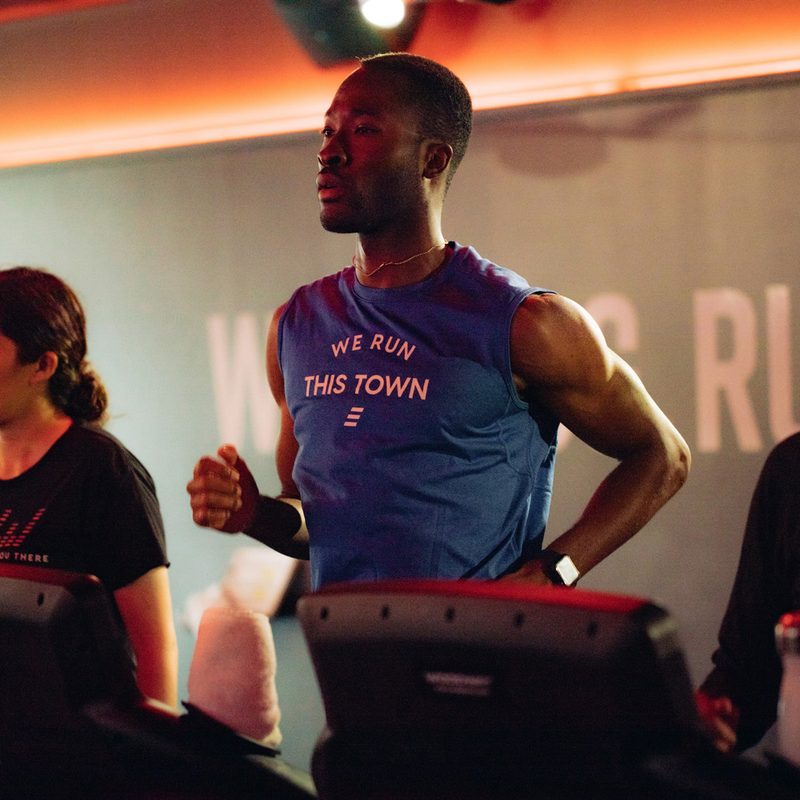 Three athletes running on treadmills at Stride Fitness