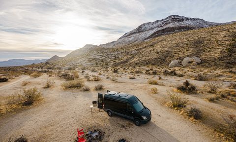 A bird's eye view of a converted Sprinter campervan parked at the Mojave National Preserve.