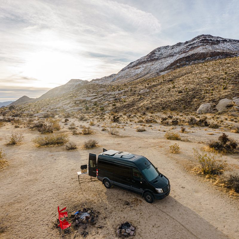 A bird's eye view of a converted Sprinter campervan at the Mojave National Preserve
