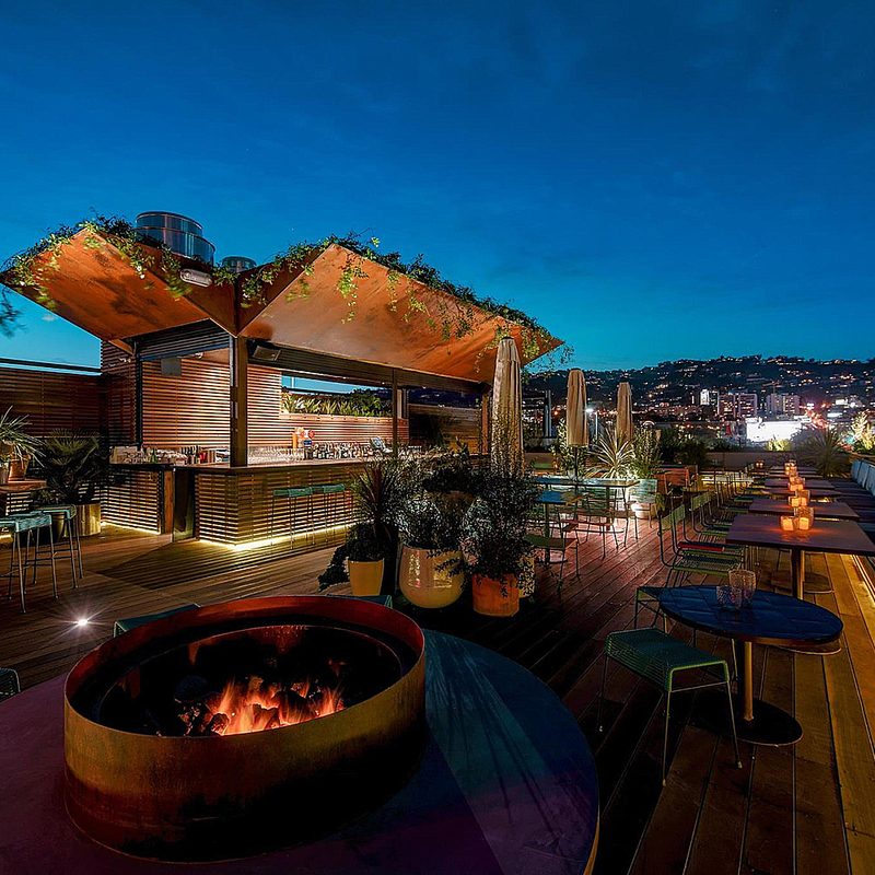 The dining and bar area of Outdoor seating and lounge area of E.P. & L.P.