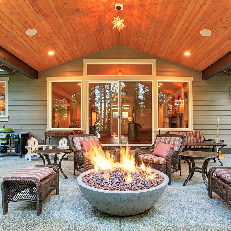 backyard fire pit with fire burning
