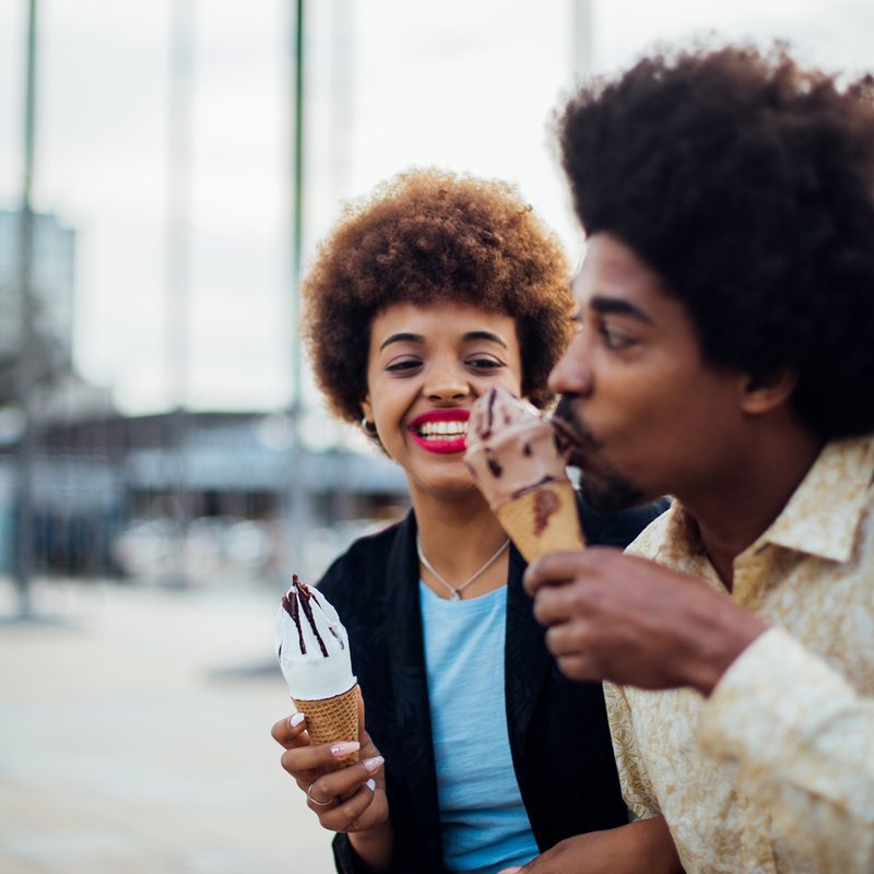 Happy couple enjoying ice cream