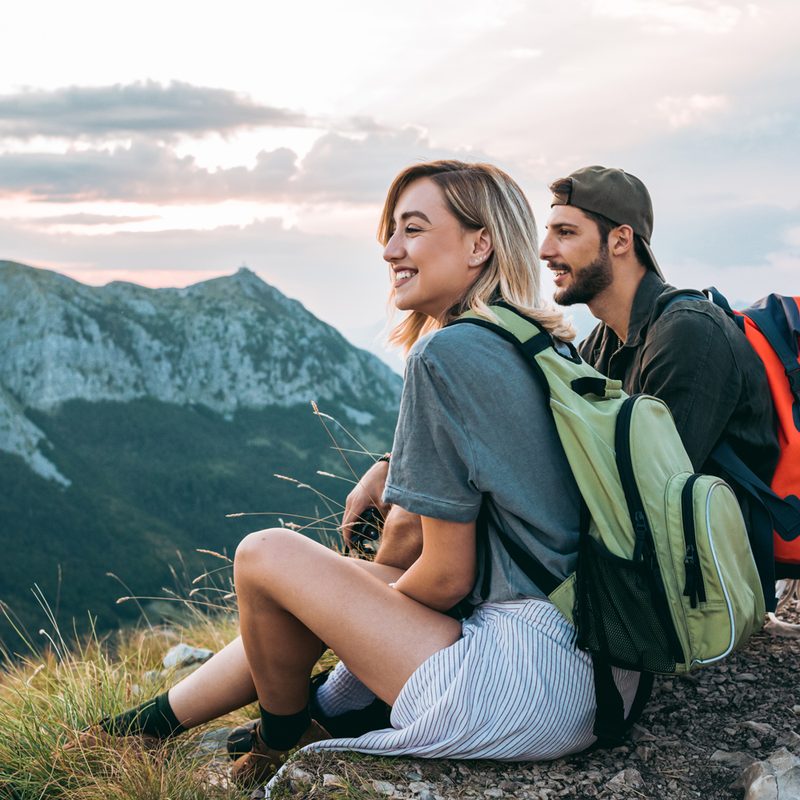 A couple resting after a long hike.