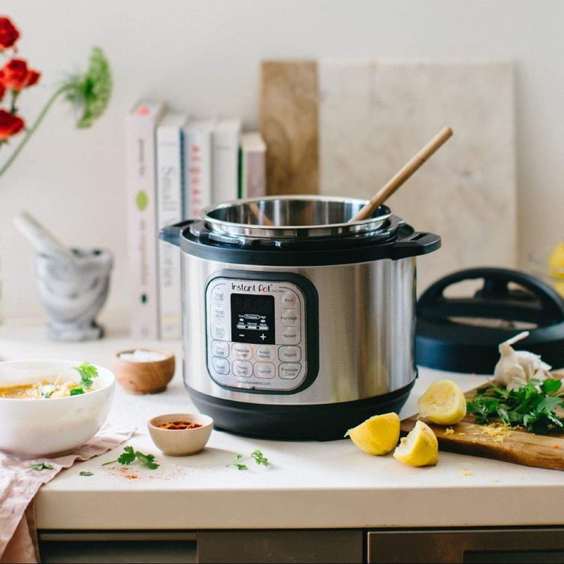 Instant Pot Duo Mini on a countertop with ingredients for soup.