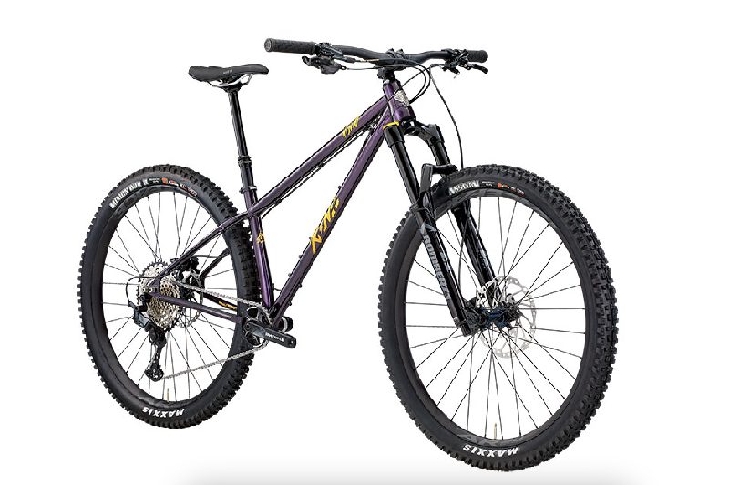 Kona Honzo bike in purple on a white studio background.