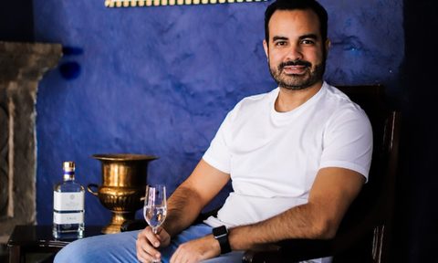 Lalo drinking a glass of LALO tequila