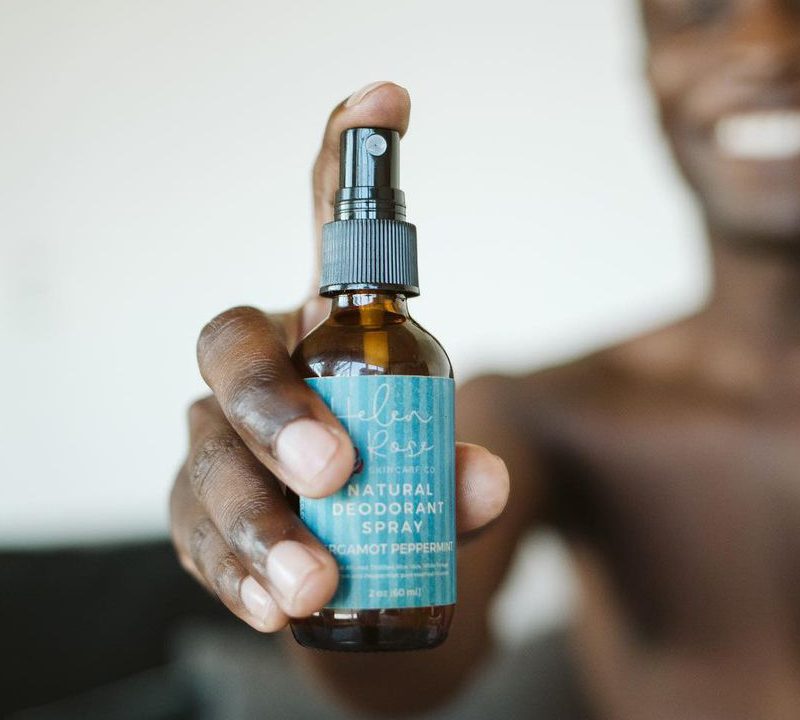 Model holding helen rose skincare spray.