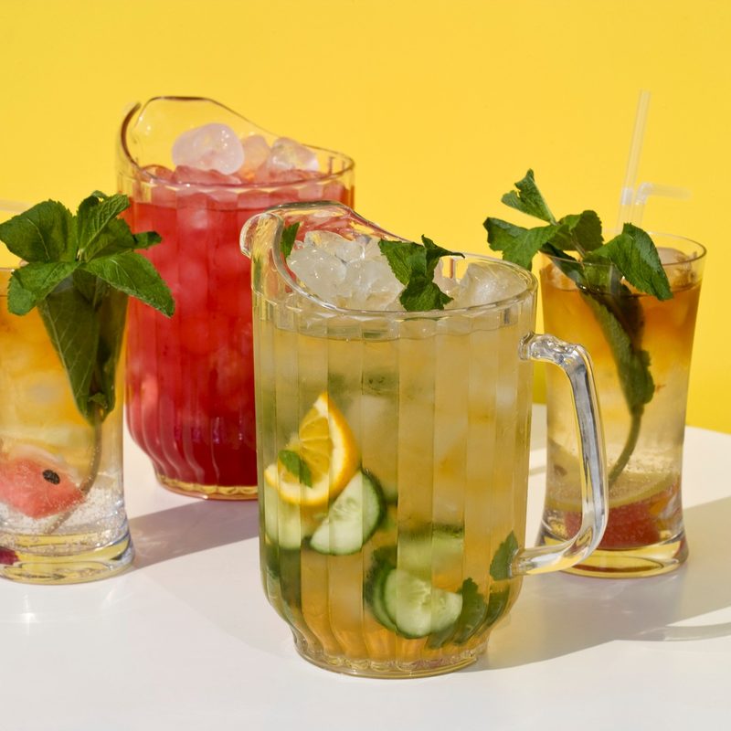 Pimm's cocktails in glasses and jugs.
