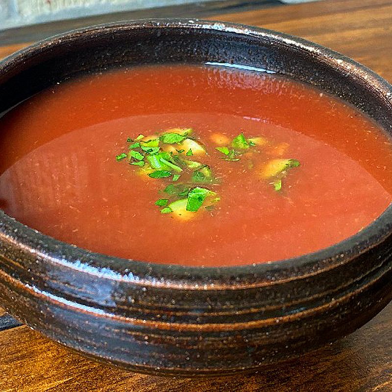A bowl of smoked watermelon gazpacho.