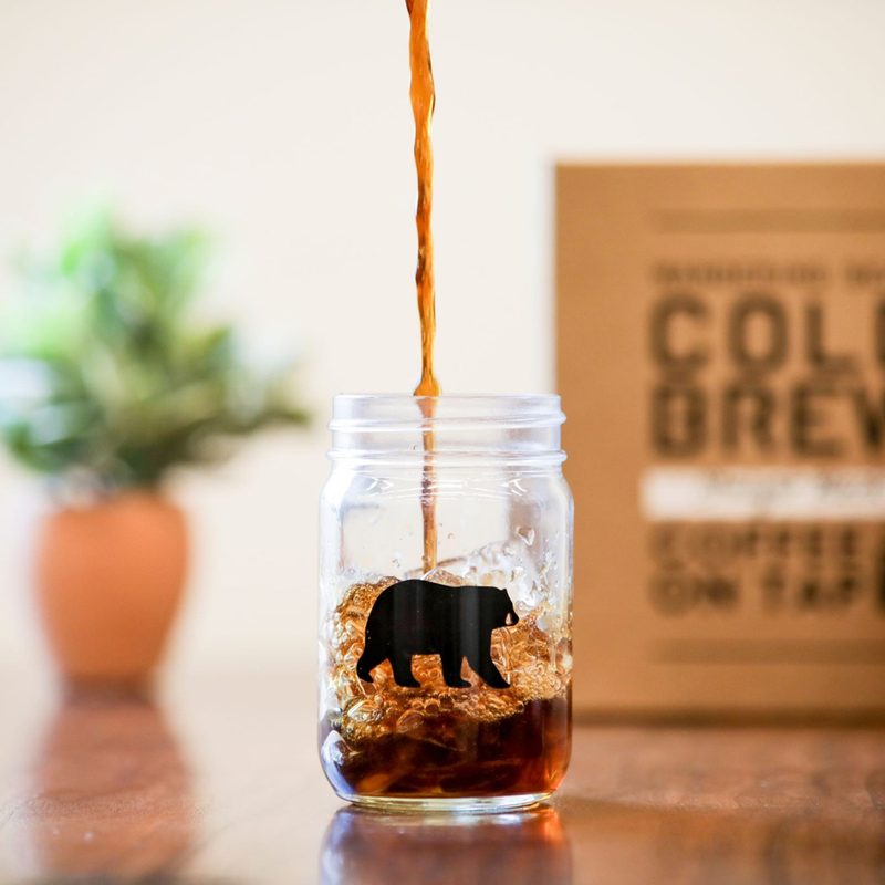 A Wandering Bear cold brew is poured into a glass.