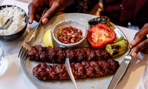 Turkish Adana kebab plate with grilled vegetables