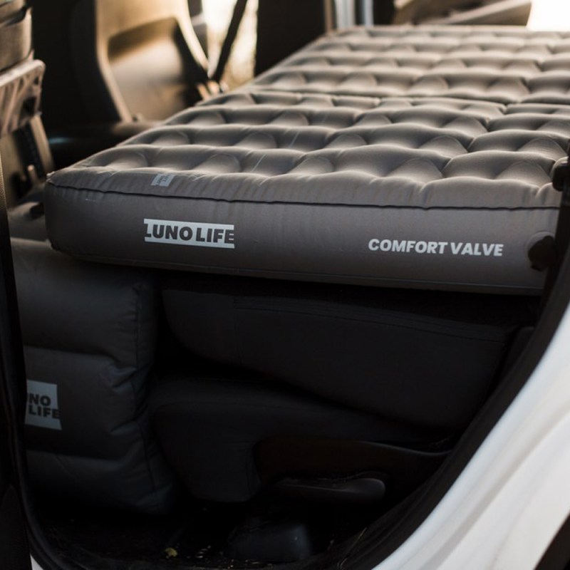 A Luno air mattress inside a white vehicle.