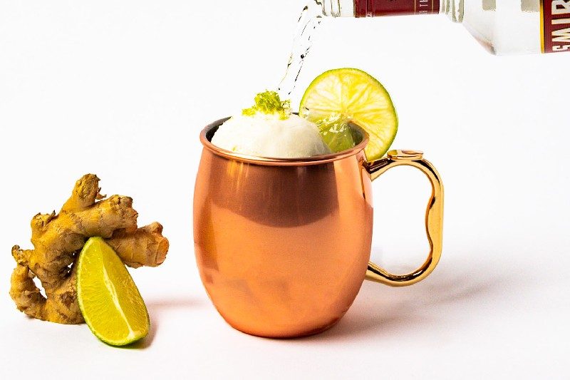 Ice cream cocktail, Atomic Ice Cream Mule, being poured a shot.