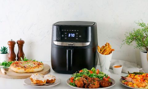 Bella Pro Series 6 QT air fryer on the counter with prepared food.
