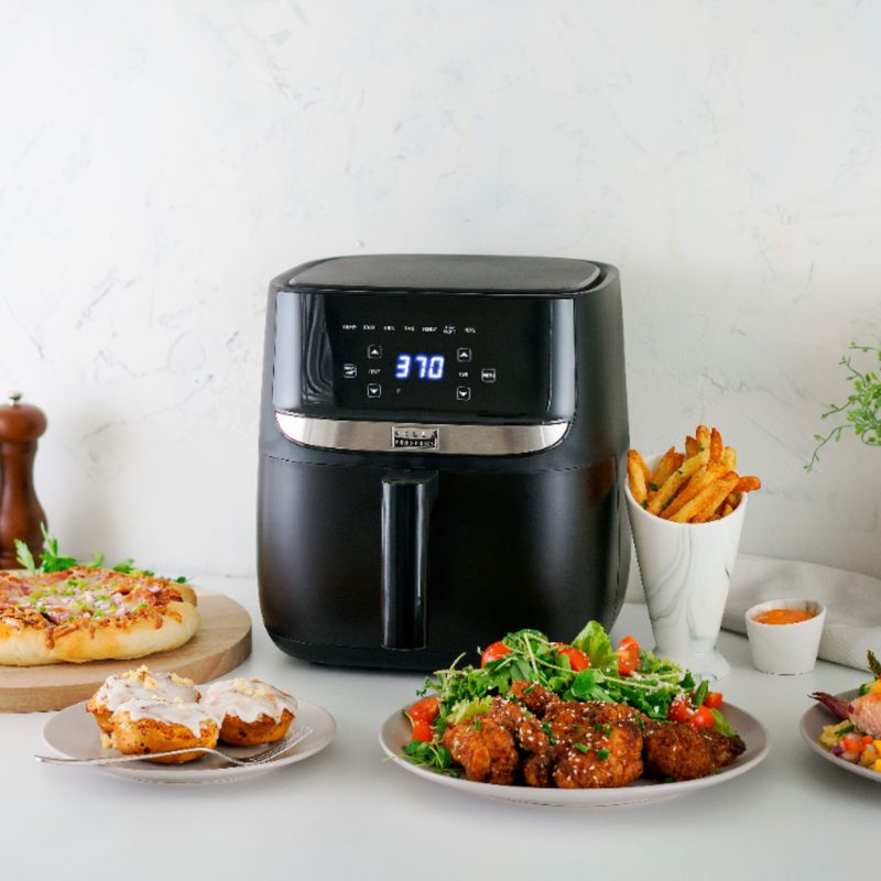 Bella Pro Series 6 QT air fryer on the counter with prepared food.