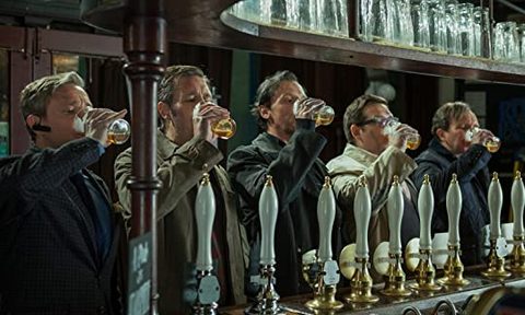 The World's End (2013) movie poster of main cast drinking beer at a bar