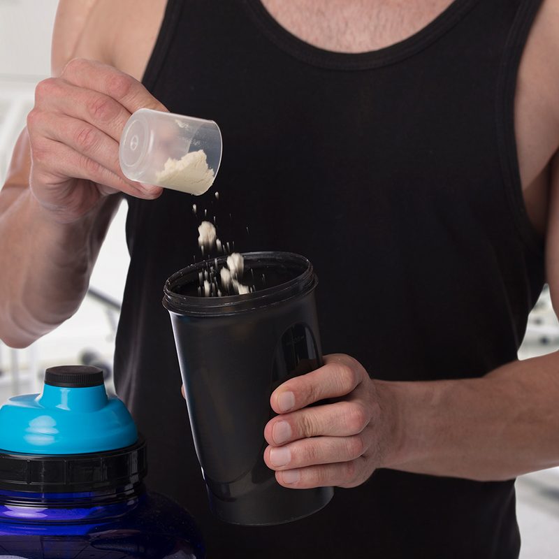 Man put whey protein in shaker