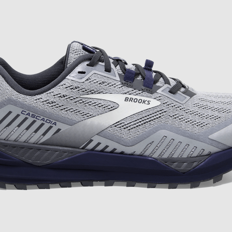 A Brooks Cascadia 15 shoe in Ebony/Silver/Deep Cobalt variant.