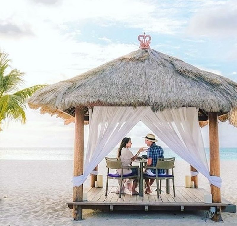 Couple in a beach hut at Bucuti & Tara Beach Resort.
