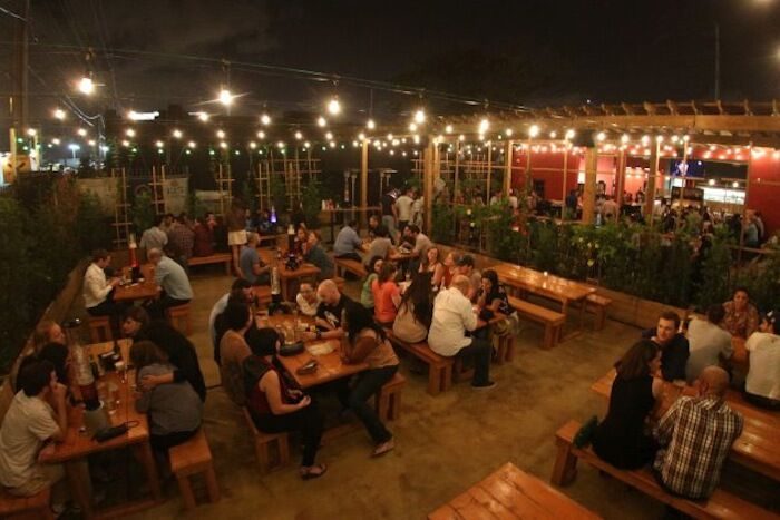 Butcher Shop Beer Garden in Miami with people on a happy night.