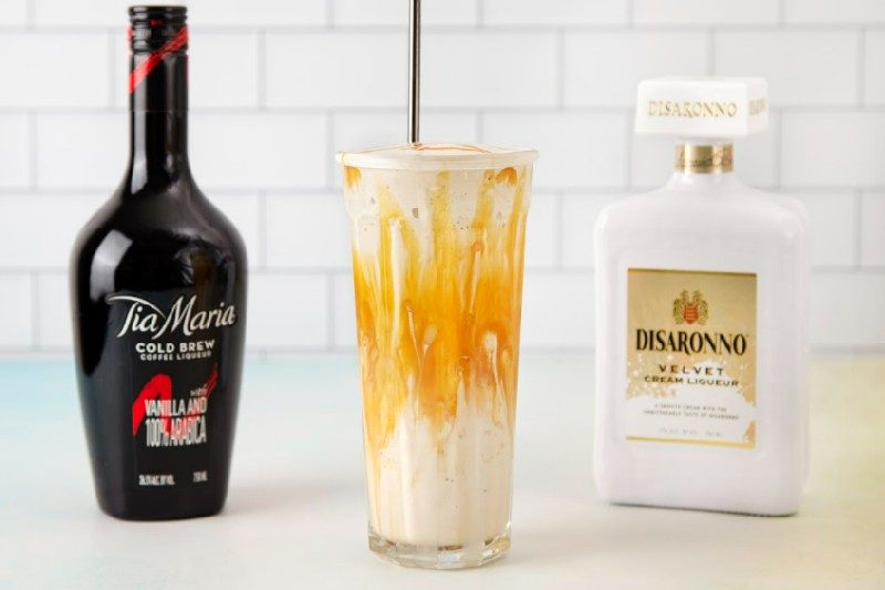 Ice cream caramel macchiato cocktail with a bottle of Disaronno and Tia Maria.