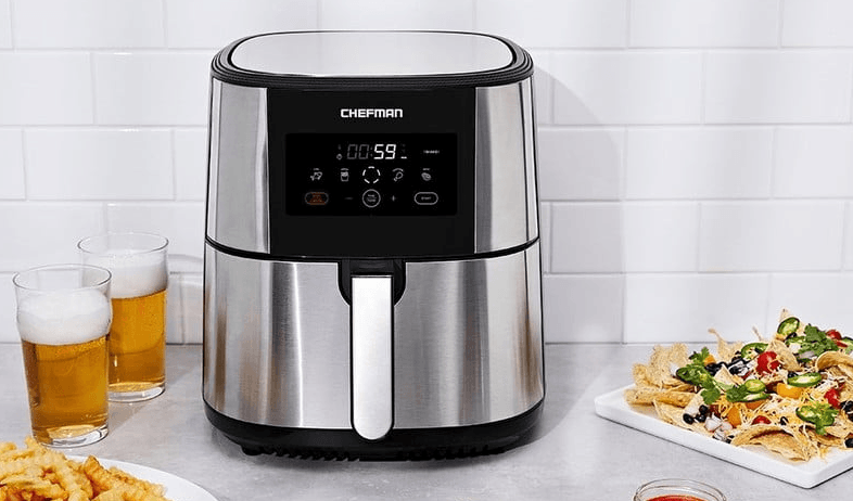 Chefman Turbofry air fryer on a table with food.