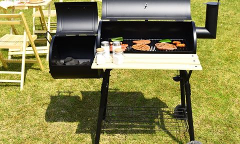 Costway Outdoor Grill with Offset Smoker in use to cook meats and more.