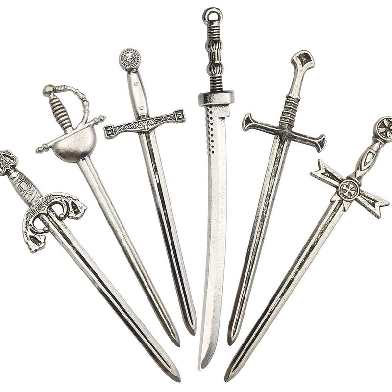 Six pieces of small silver swords for bookmarks in white background.