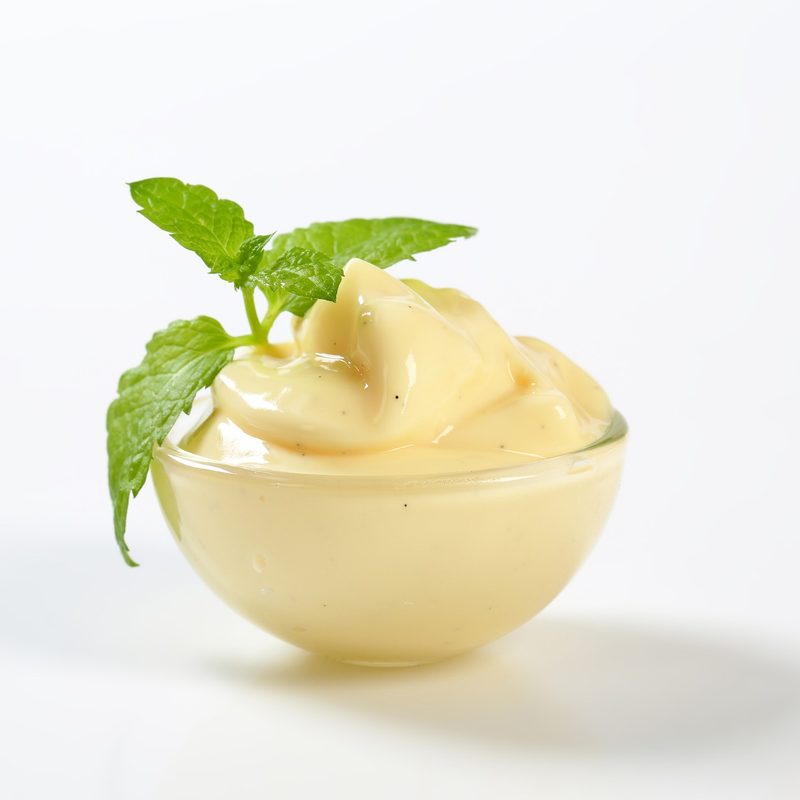 Custard ice cream garnished with mint leaves.