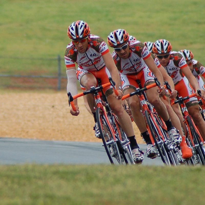 A group of cyclists riding together