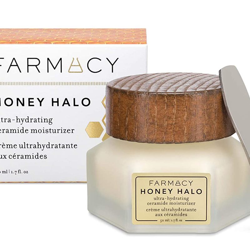 A jar of Farmacy Honey Halo Ceramide Face Moisturizer and its box on white background