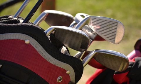 Golf clubs in a bag.