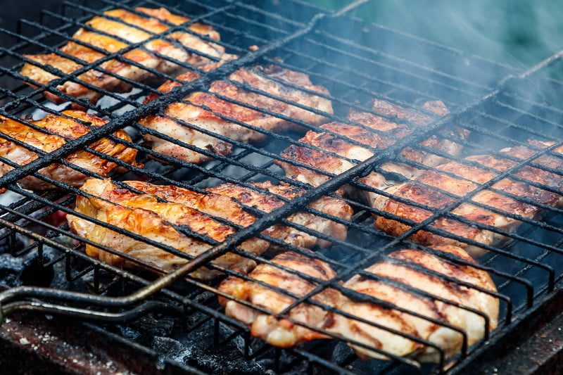 Peri peri chicken grilling.