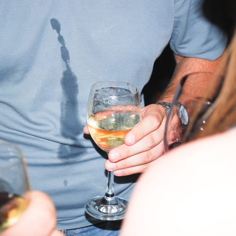 A liquor stain on a man's shirt.