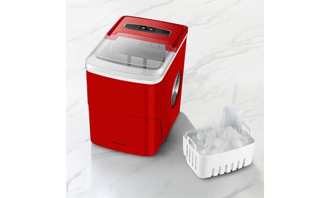 Insignia 26 Pound Portable Icemaker with the ice tray placed next to it.