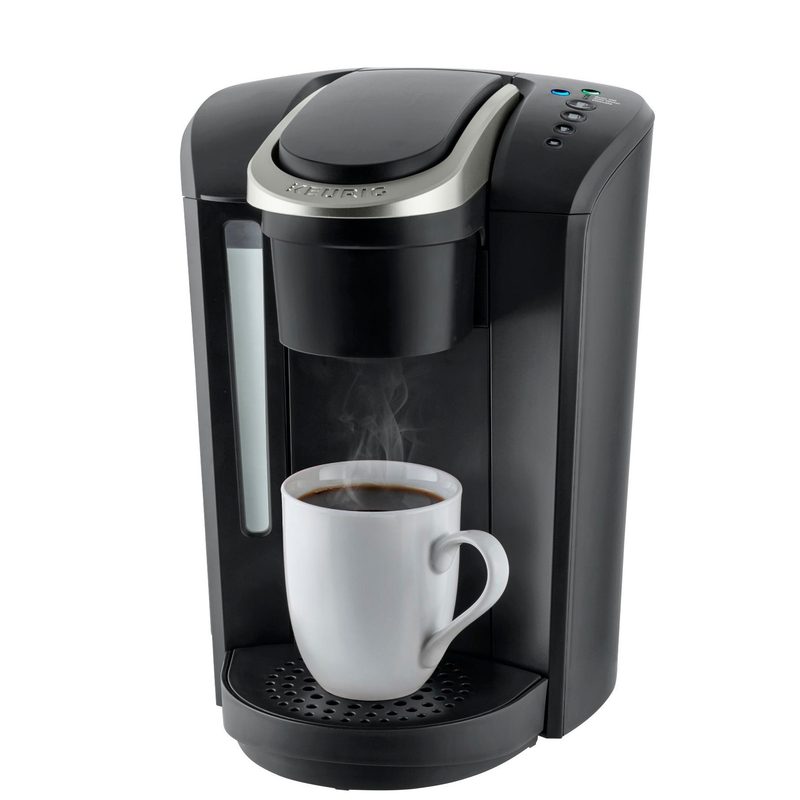 Keurig K-Select Single-Serve Maker with standard mug and brewed coffee.