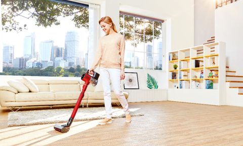 The LG CordZero Cordless Stick Vacuum being used to clean a home.