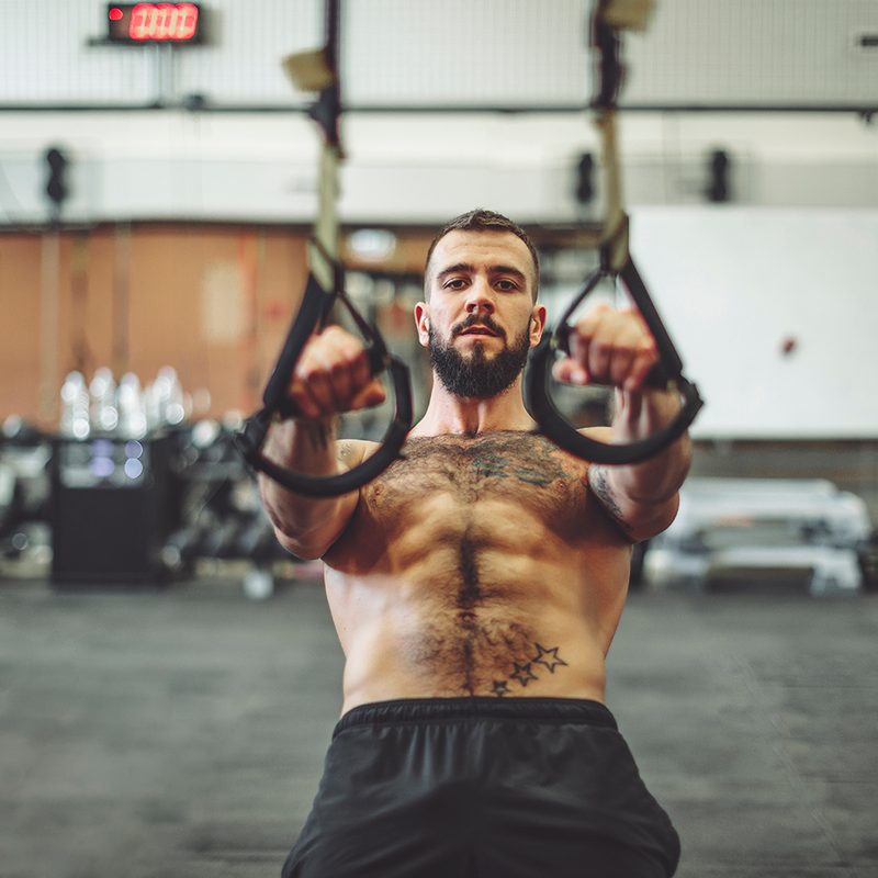 Strong man is doing cross training exercise