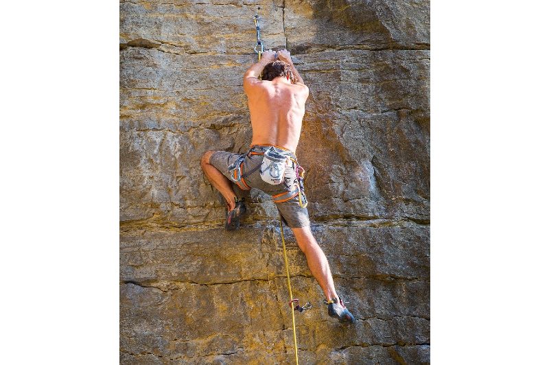 Man rock climbing alone
