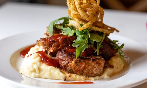 Meatloaf, garlic mashed potatoes, and crispy onion straws from Joy's Cafe