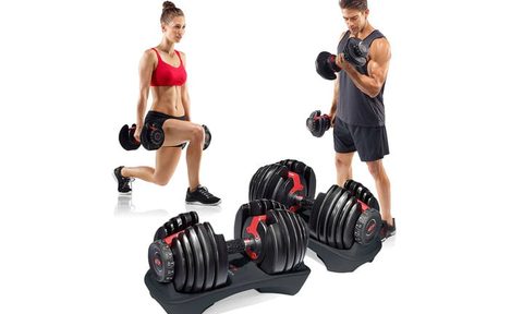 Man and woman using Bowflex ST 552 dumbbells.