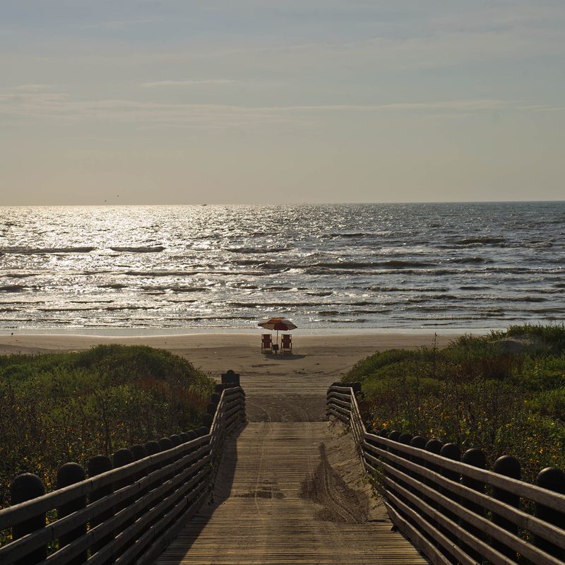 A deserted beach and sun chairs in Port Aransas, Texas, U.S.