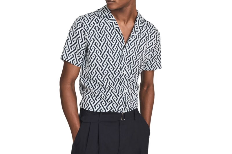 A geometric pattern men's camp collar shirt in white and navy.
