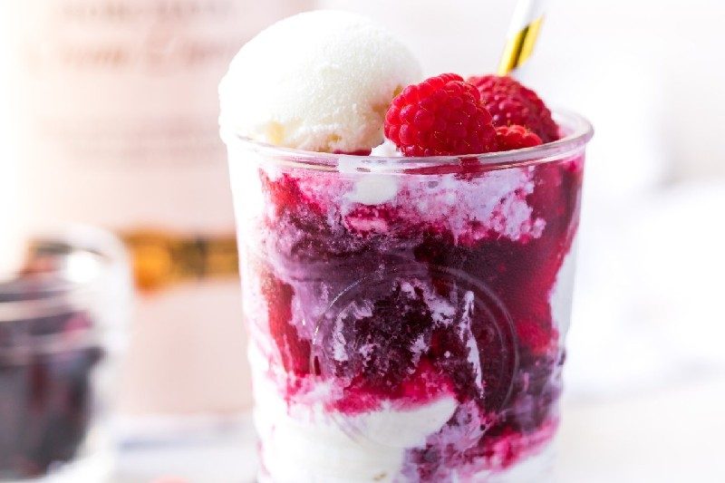 ice cream cocktail, ricura raspberry, served in a glass.