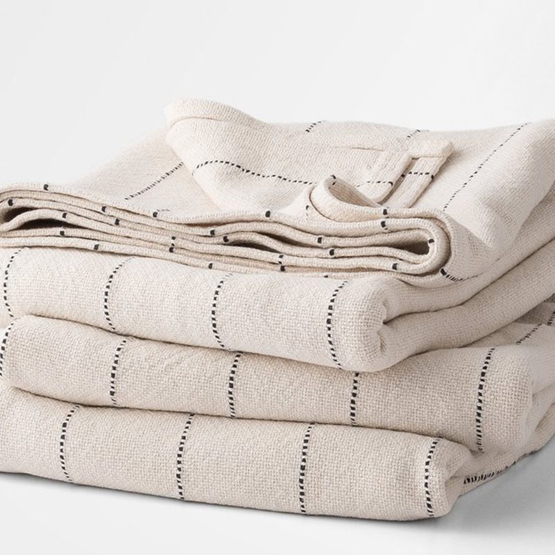 Properly folded Schoolhouse Cotton Pinstripe Blanket.