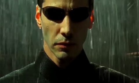 Keanu Reeves as Neo in a trailer screenshot.