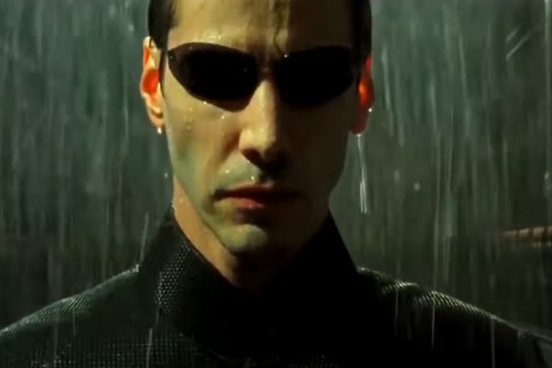 Keanu Reeves as Neo in a trailer screenshot.