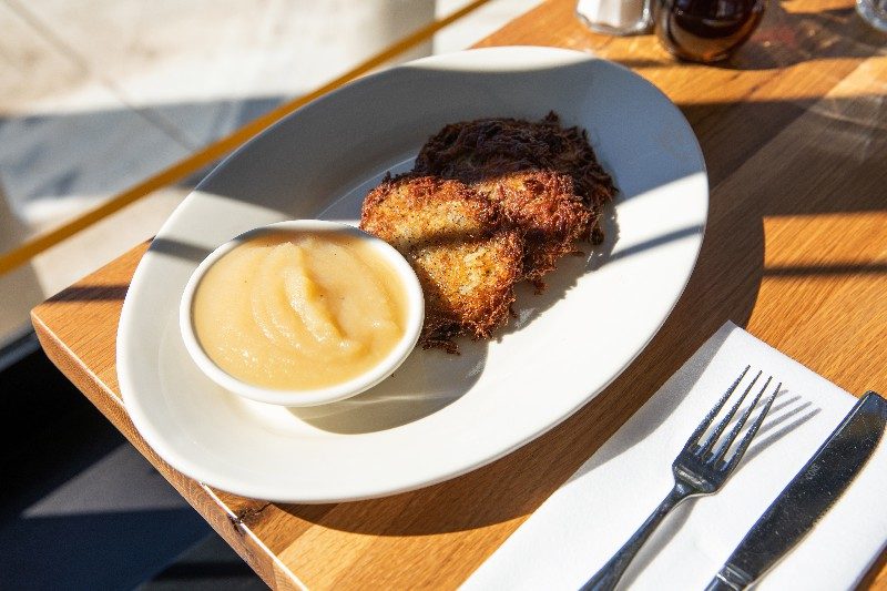 Latkes with sour cream and applesauce.