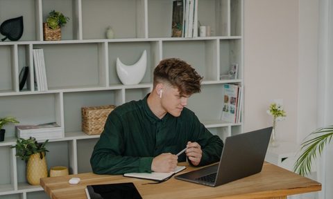 student on laptop watching Prime Video.