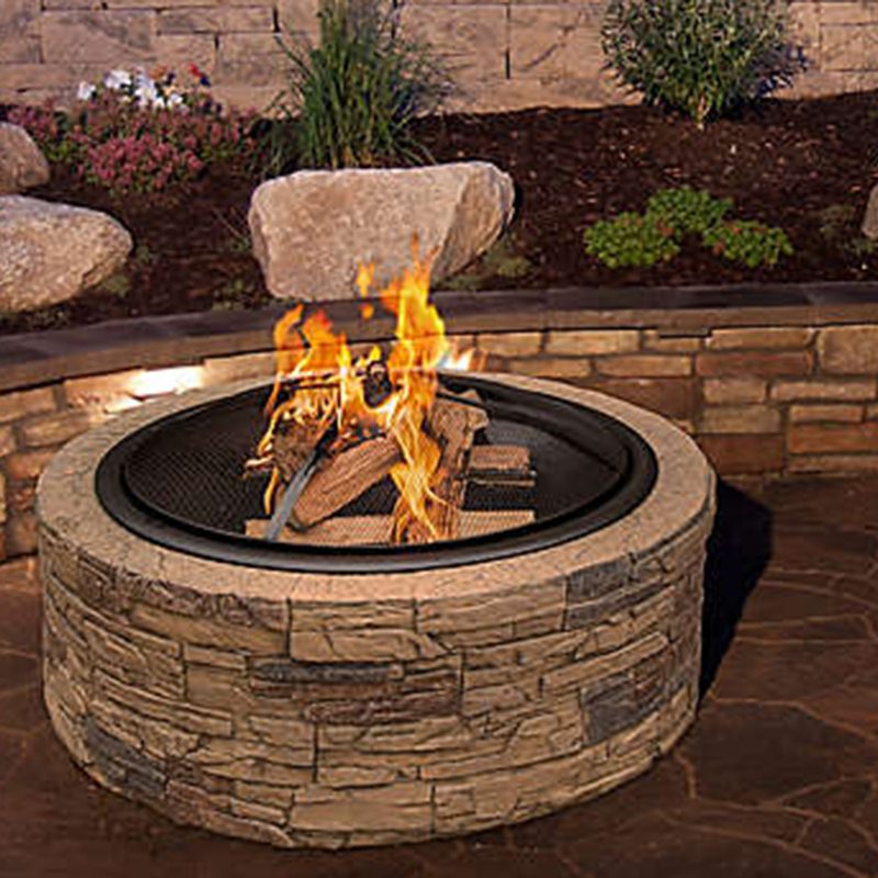 Sun Joe Fire Pit in the backyard.
